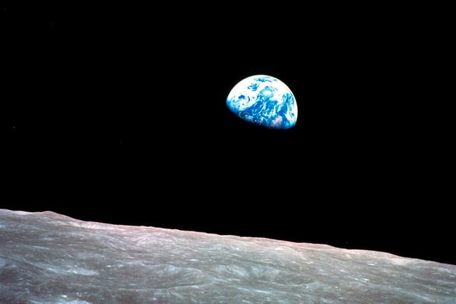 <p>1968, file photo made available by NASA shows the Earth behind the surface of the moon during the Apollo 8 mission</p>
